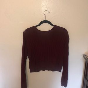 A stylish maroon long sleeve sweater